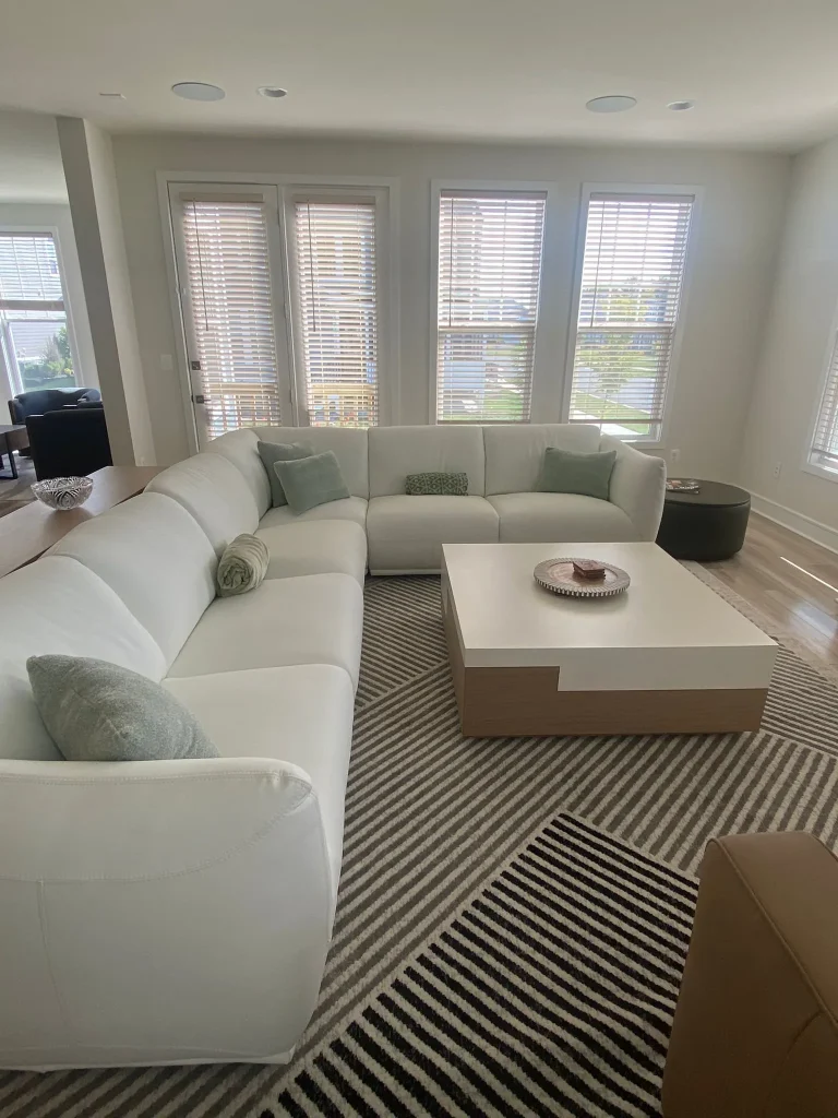 Luxury living room cleaning white sectional sofa striped rug Leesburg VA