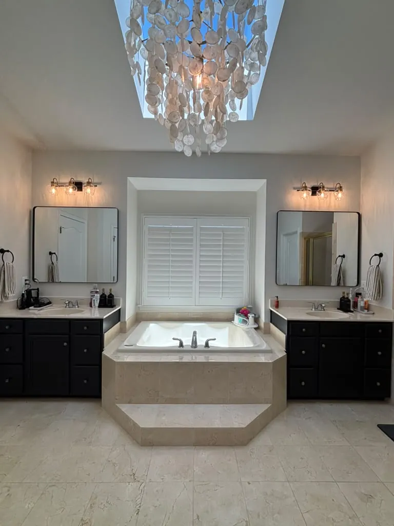 Deep-cleaned master bathroom with soaking tub and double vanity